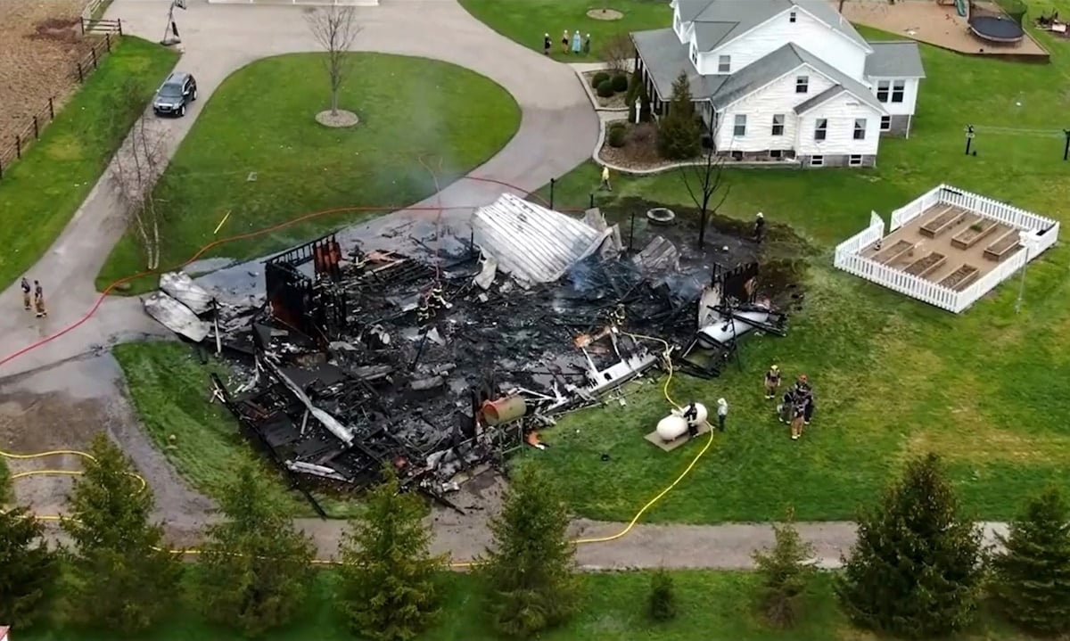 Aerial view of Amish barn destroyed by fire and explosion in Geauga County, Ohio, with house nearby