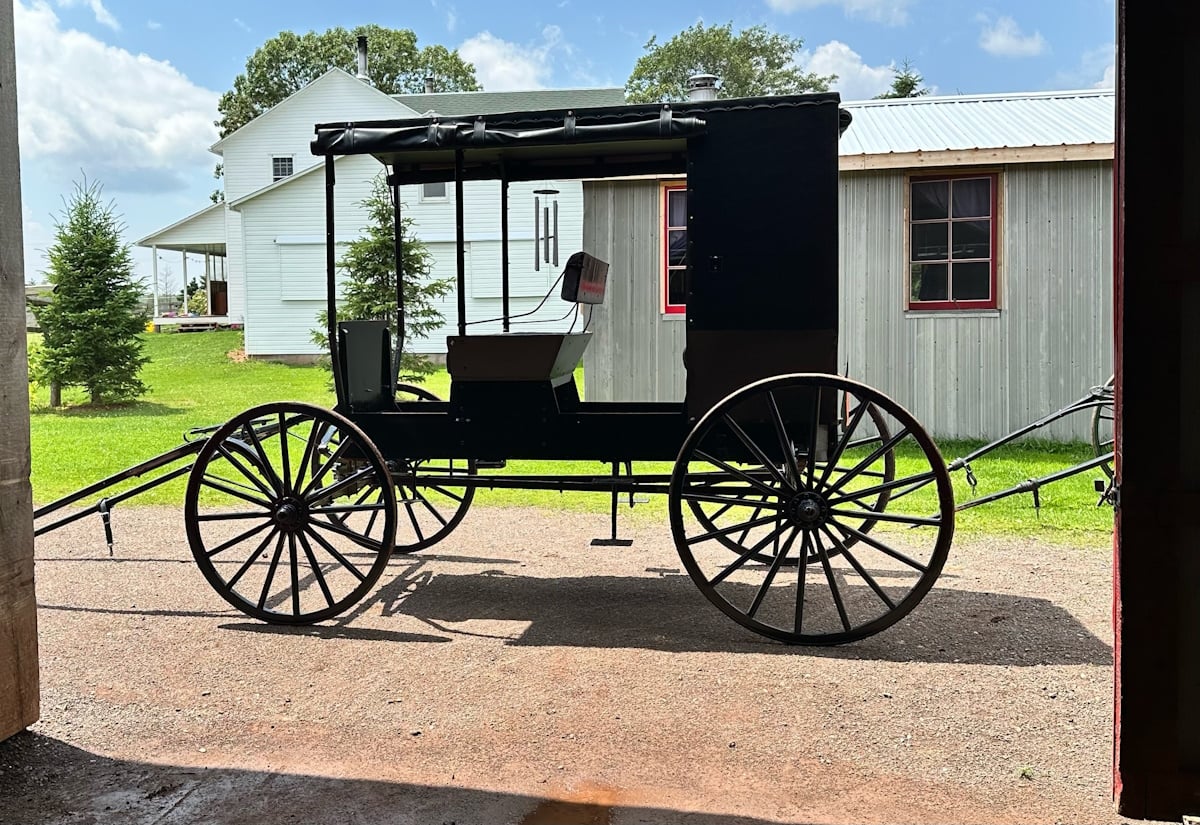 An open-sided Amish buggy with no doors or enclosed cab, Prince Edward Island, Canada
