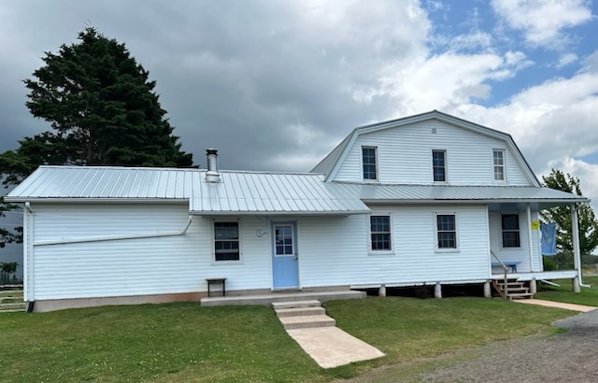 An Amish home with a rounded barn-style roof, Prince Edward Island, Canada