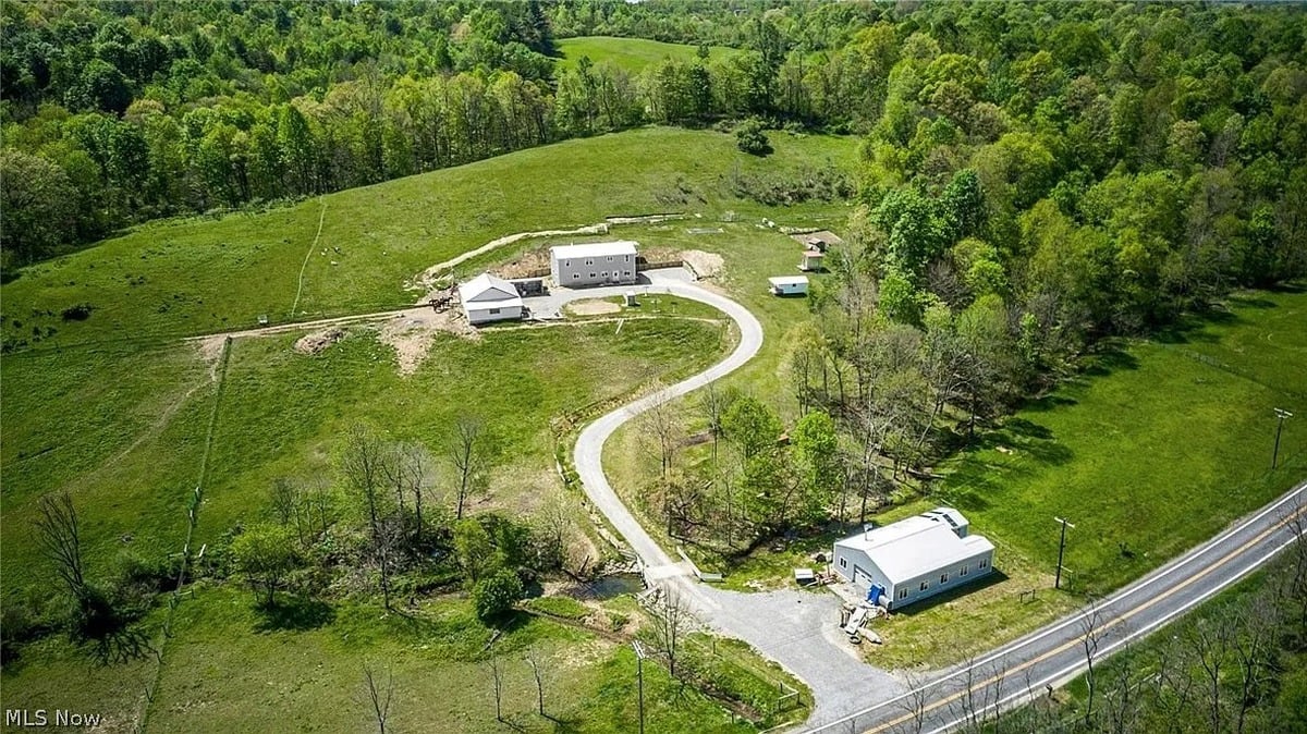 Aerial view of Amish homestead in Cumberland Ohio showing house barn and winding driveway