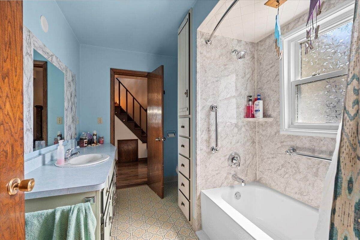 Bathroom with tiled shower and tub in Amish farmhouse, New Holstein, Wisconsin