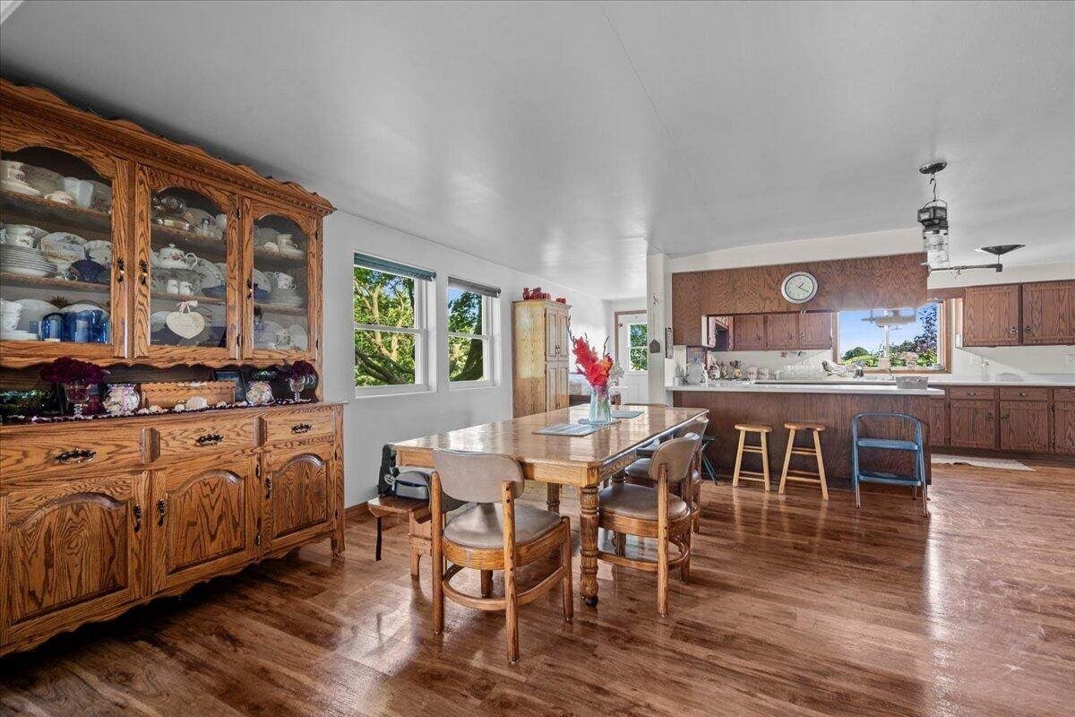 Dining room with large oak hutch and dining table in Amish farmhouse, New Holstein, Wisconsin