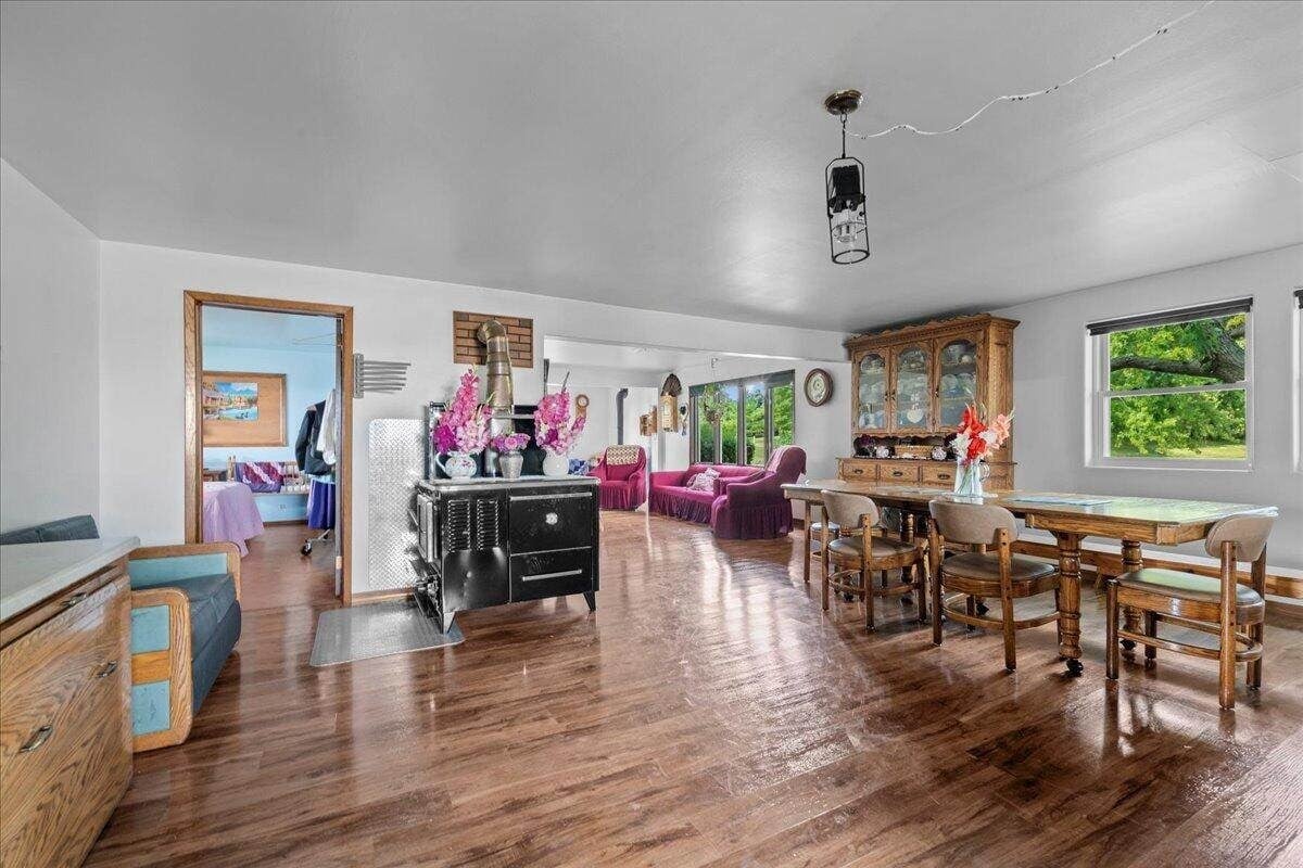 Living area with black cast-iron wood-burning cook stove in Amish farmhouse, New Holstein, Wisconsin