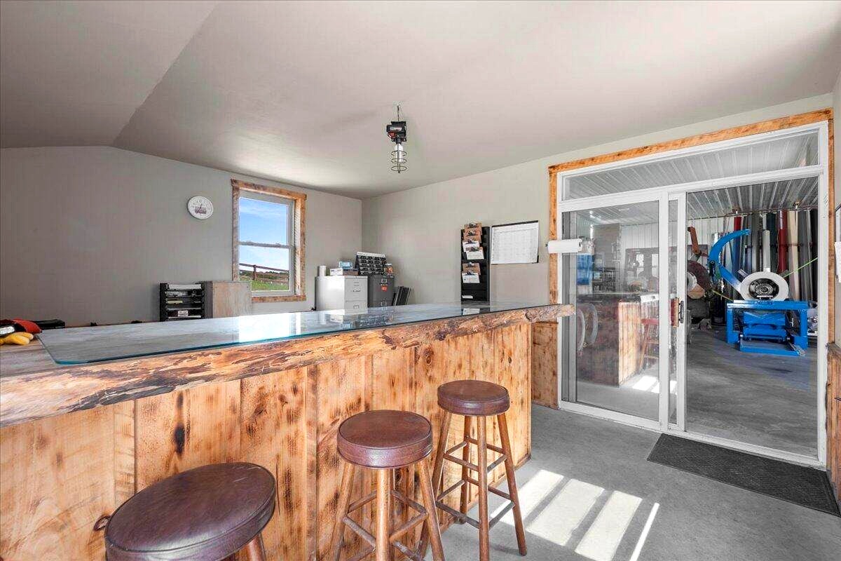 Shop office with live-edge wood counter and bar stools at Amish farm in New Holstein, Wisconsin
