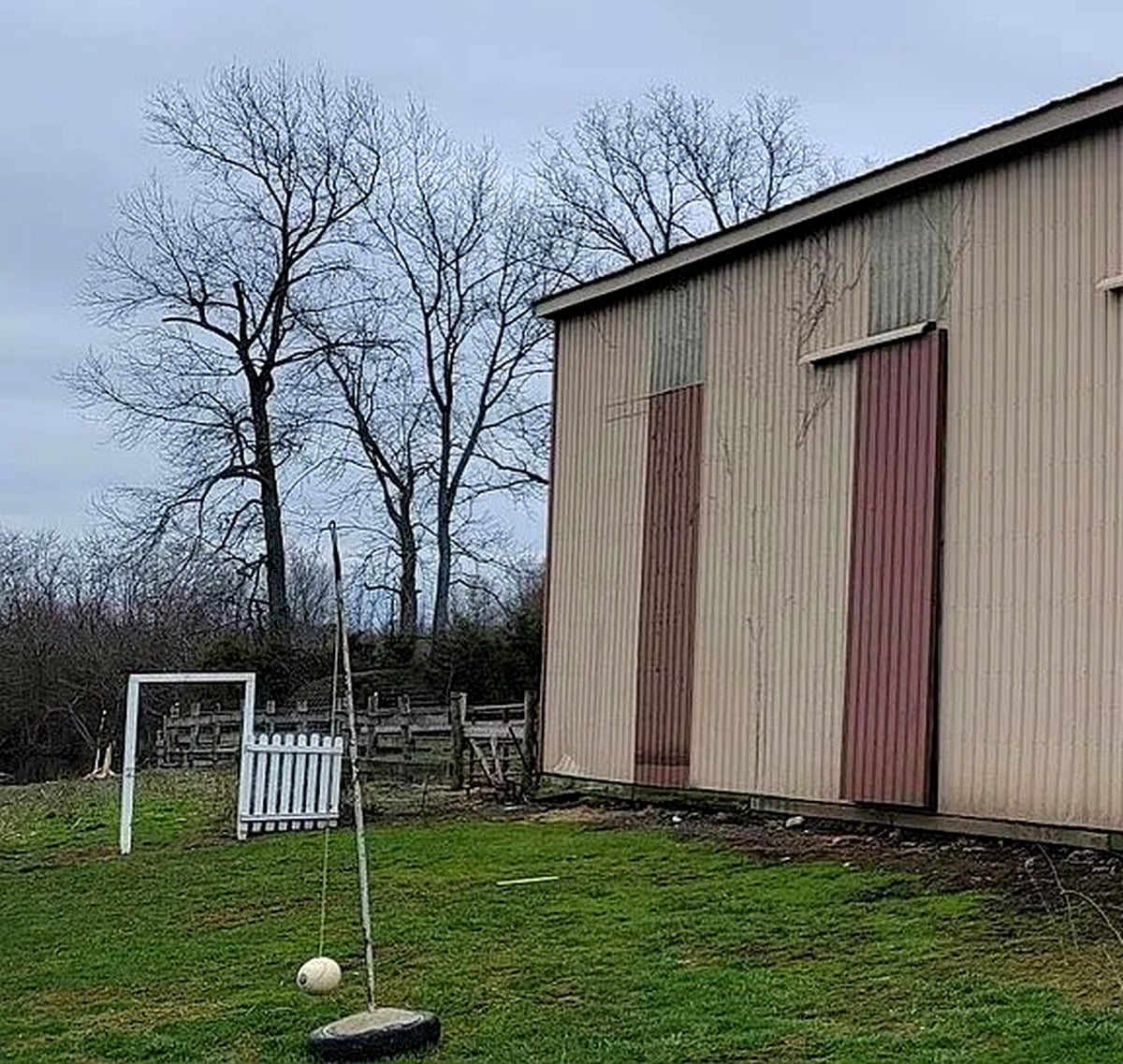 Tetherball pole and soccer goal in barn yard at Amish farm in Vevay, Indiana