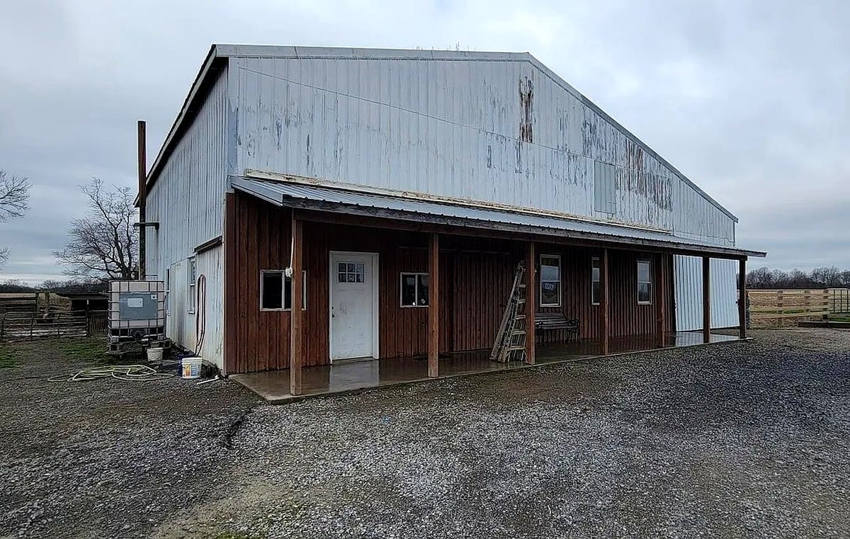 Workshop building exterior with covered porch at Amish farm in Vevay, Indiana