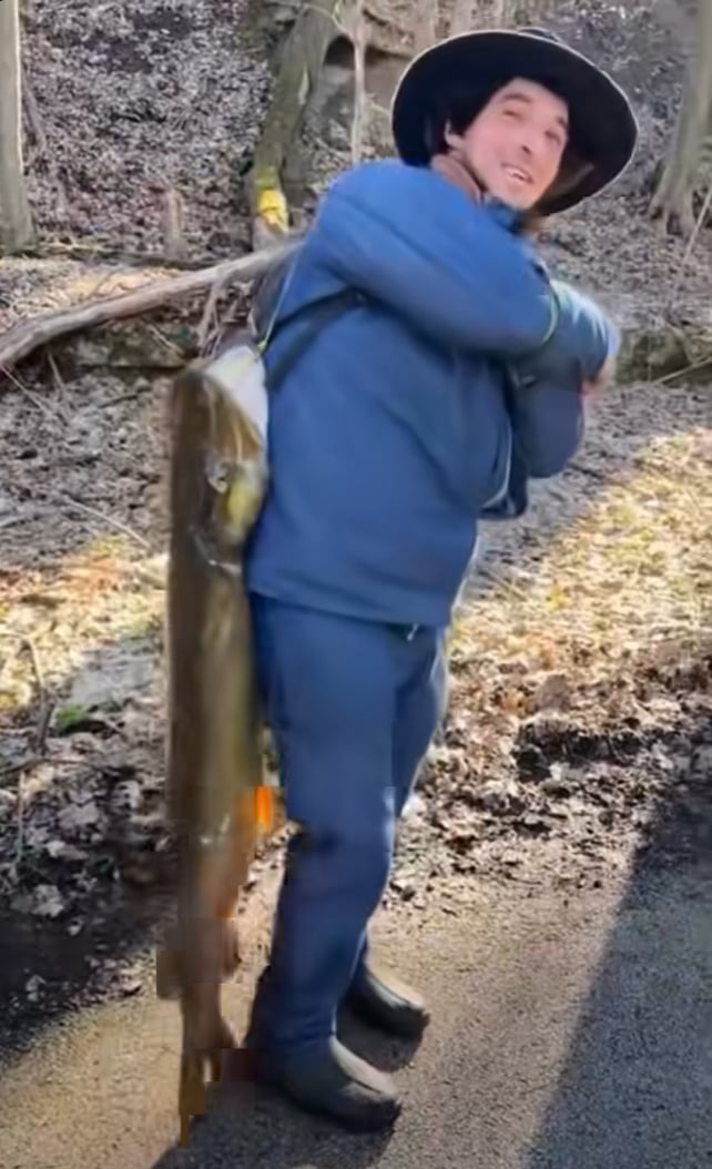 Amish man smiling full length giant muskie