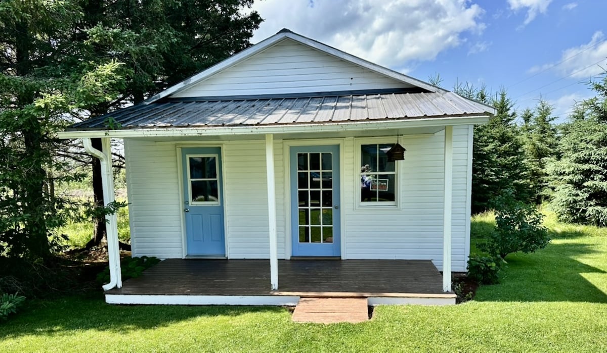 A one-room Amish school with a blue door, closed for the summer, on Prince Edward Island, Canada