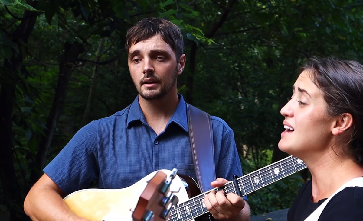 Ben and Rose singing together in the Will You Travel Down This Road With Me video