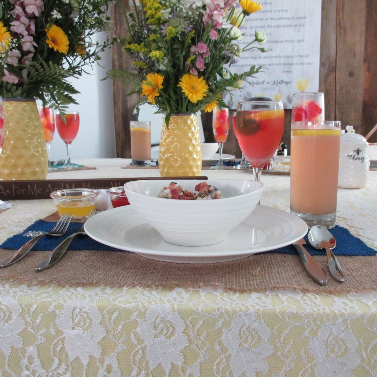 Bridal table setting with drinks and wildflowers at an Amish wedding