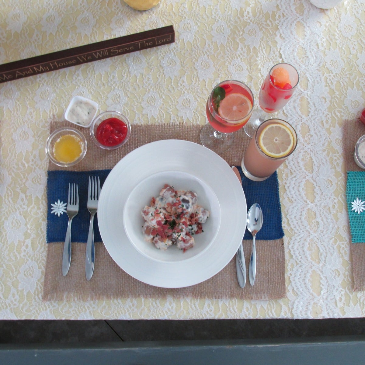 Bridal table place setting at an Amish wedding with a bowl, fruit and drinks