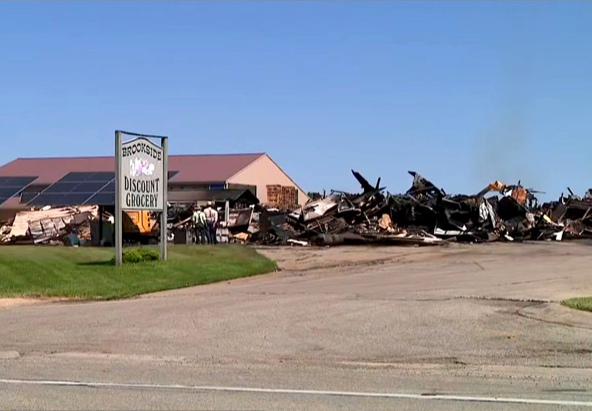Brookside Discount Grocery after overnight fire, Newaygo County, Michigan Brookside Discount Grocery sign stands in front of fire damage and rubble after overnight fire, Garfield Township, Michigan