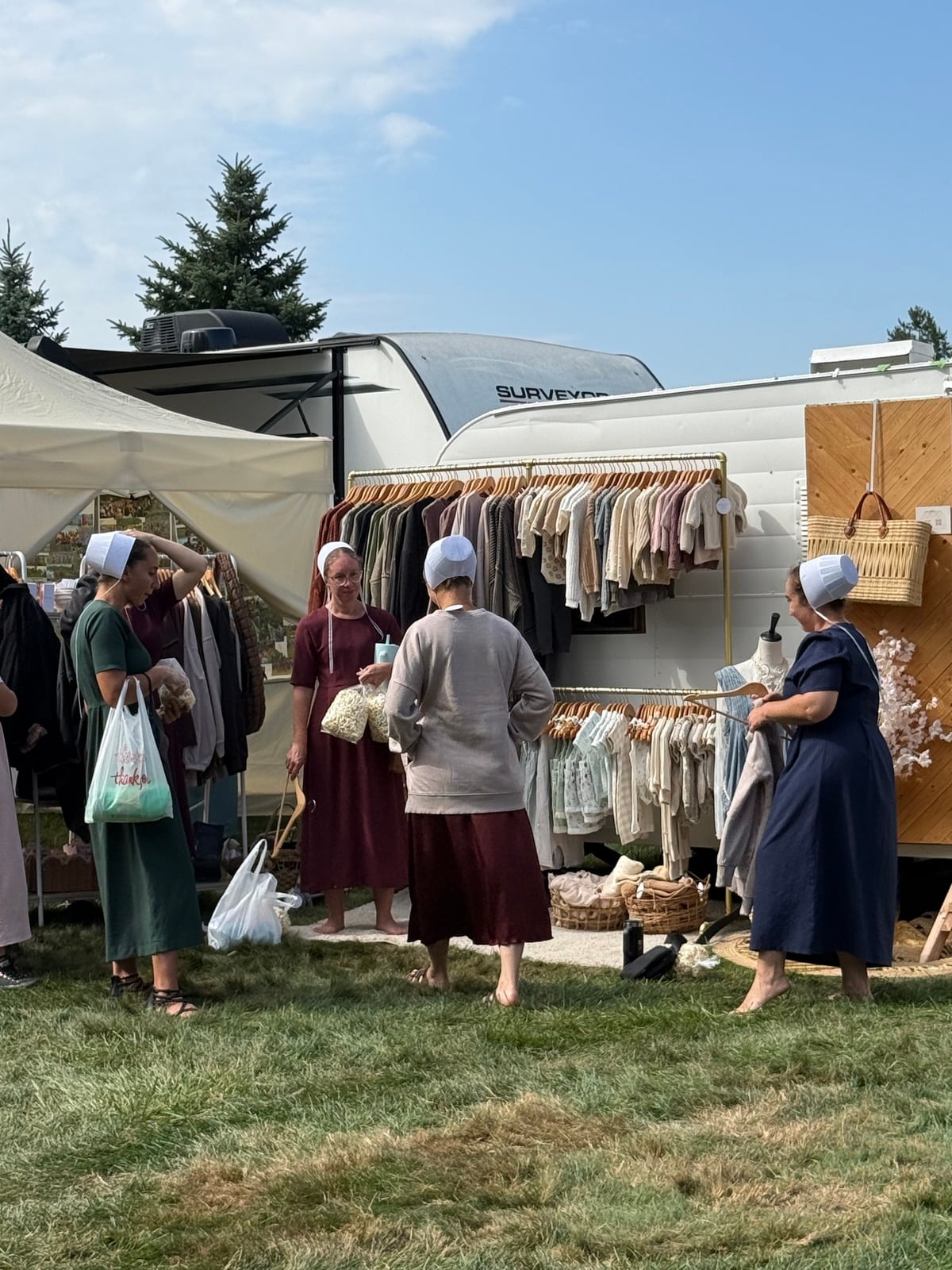 Amish women shopping at a clothing booth at Rentown Old Fashion Days