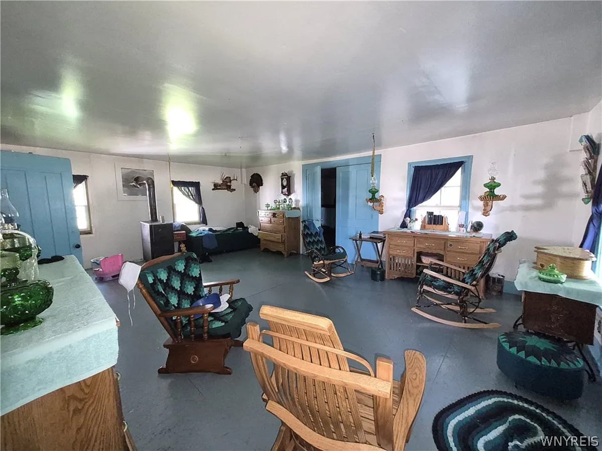 Hickory rocking chairs with quilted cushions and an oak desk in an Amish front room