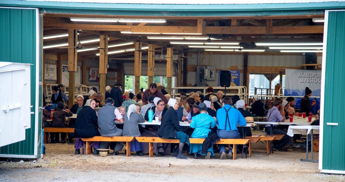 Amish church benches in use at the community supper