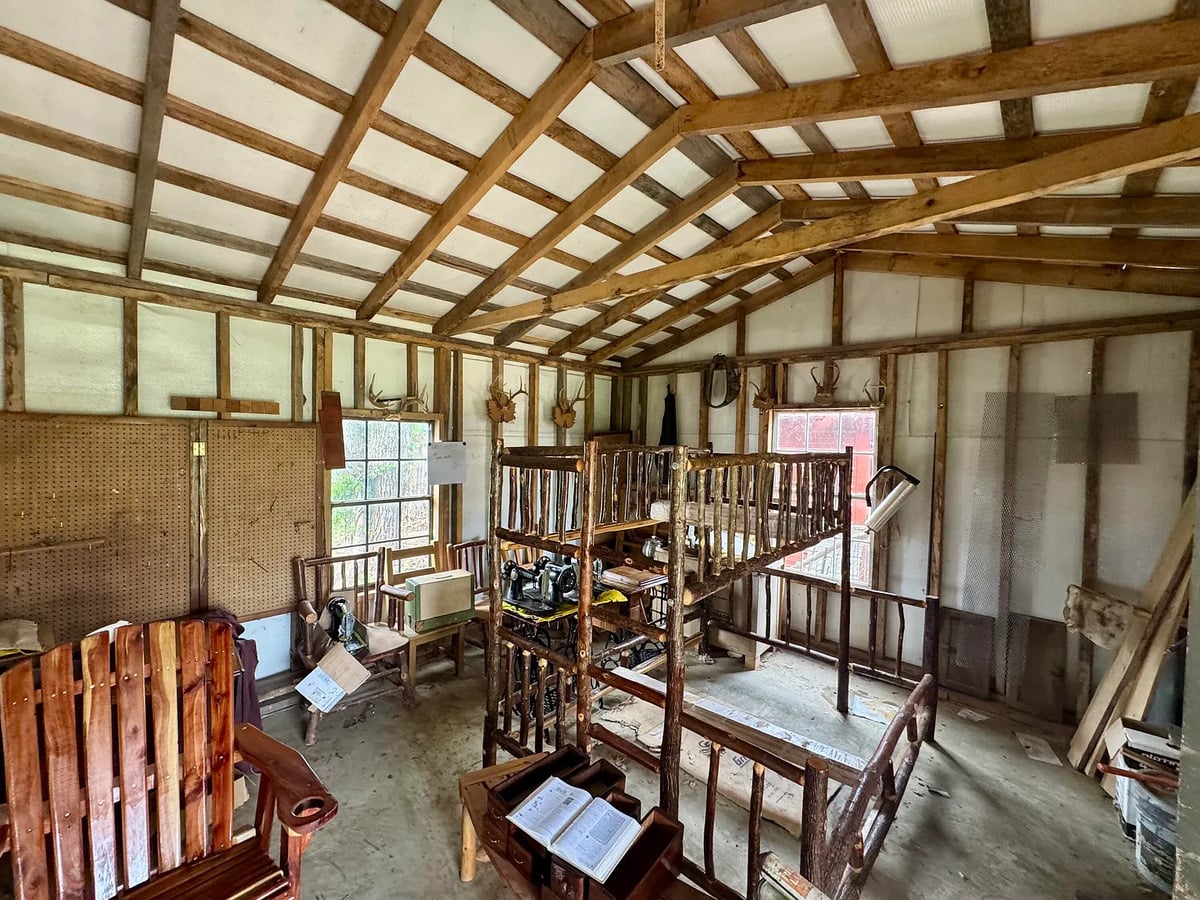 Hickory bunk bed and treadle sewing machines inside an Amish furniture shop in Randolph, Mississippi