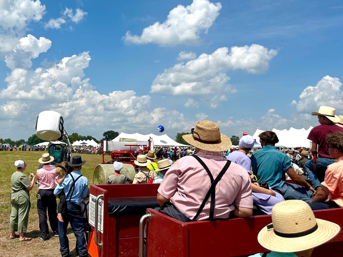 Round baler demo – Horse Progress Days 2026 Amish crowd watching a round baler demonstration at Horse Progress Days 2026