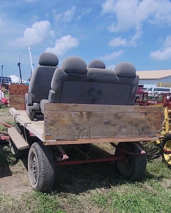Wooden farm wagon fitted with salvaged passenger van seats
