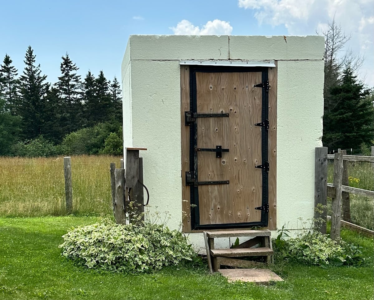 An insulated Amish icehouse used to store blocks of lake ice, Prince Edward Island, Canada