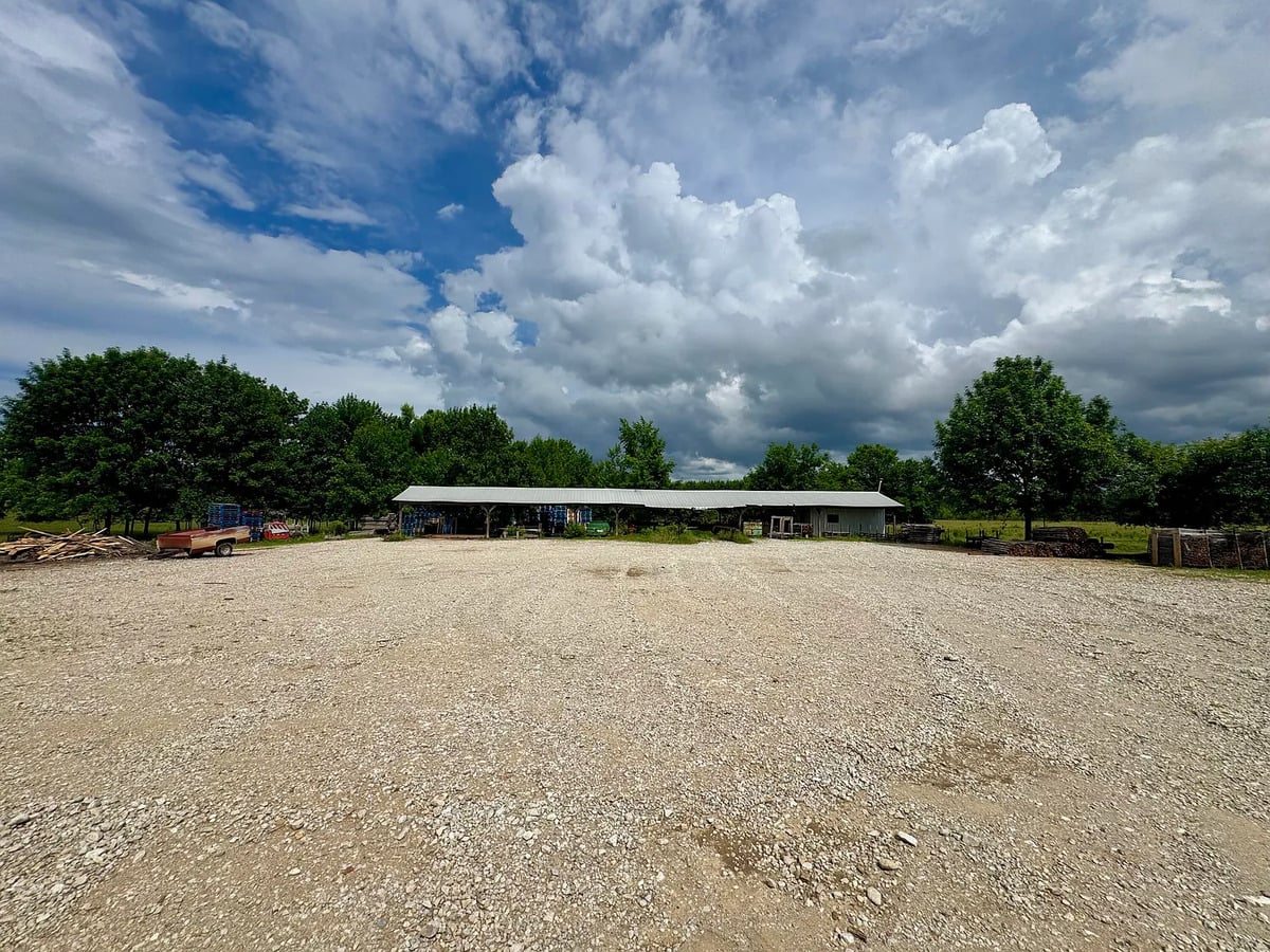 Long pole shed and gravel lot on an Amish farm in Randolph, Mississippi