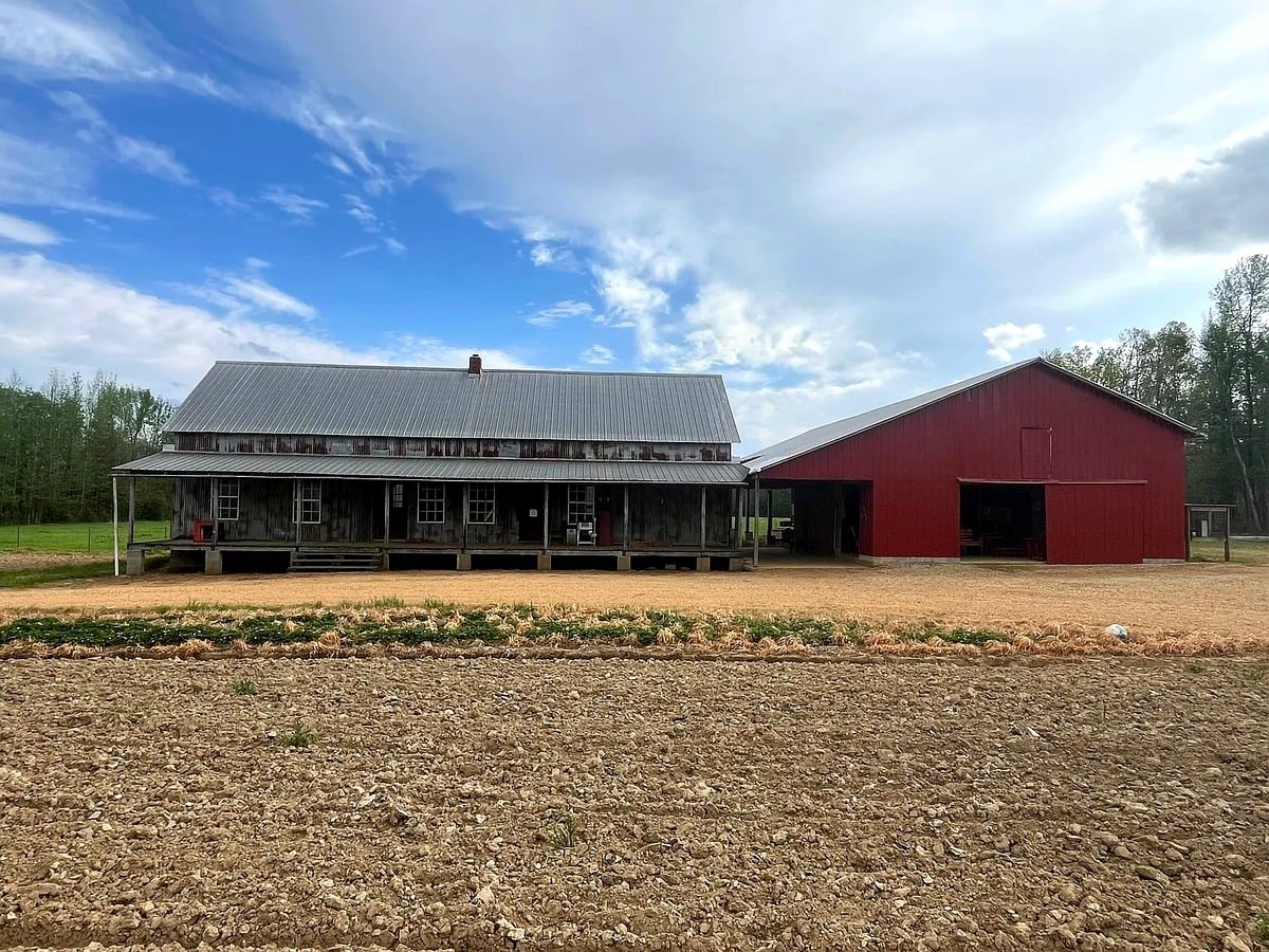 Amish furniture shop building and red barn in Randolph, Mississippi
