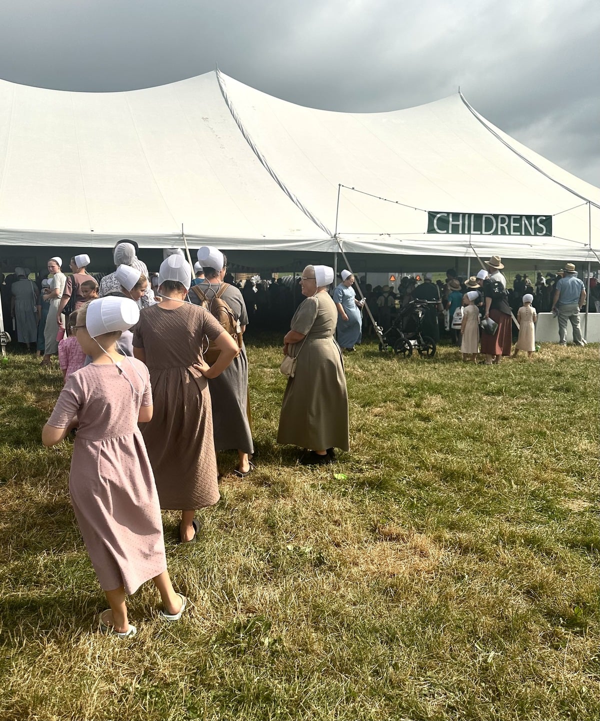Amish children waiting in line for an activity at Family Farm Field Days