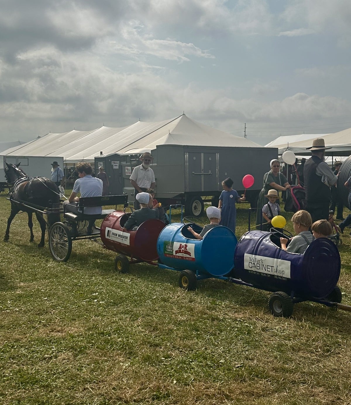 Children riding the barrel train at Family Farm Field Days in Ohio