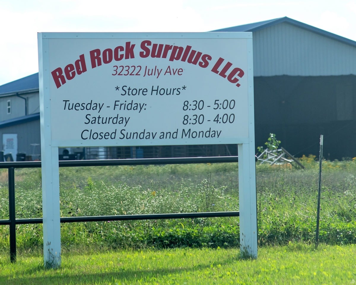 Red Rock Surplus sign with store hours