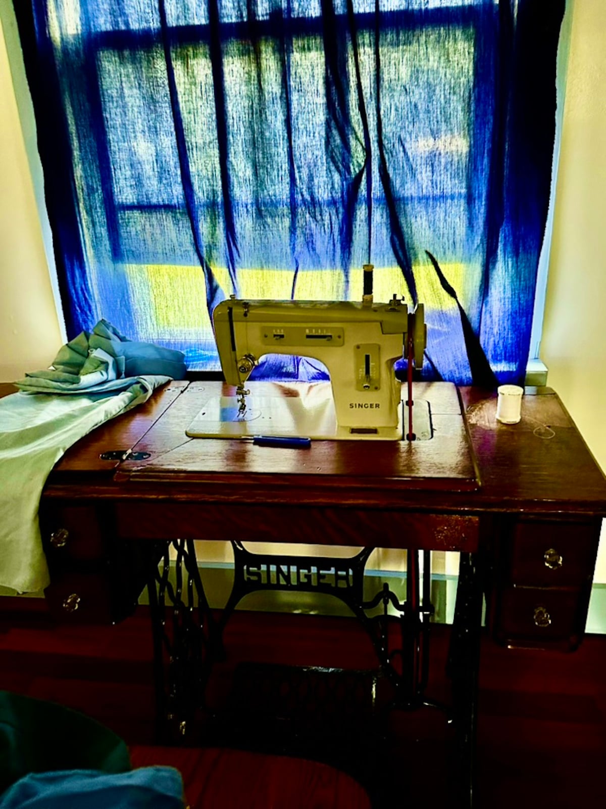 A vintage Singer treadle sewing machine beside a window in an Amish home on Prince Edward Island, Canada