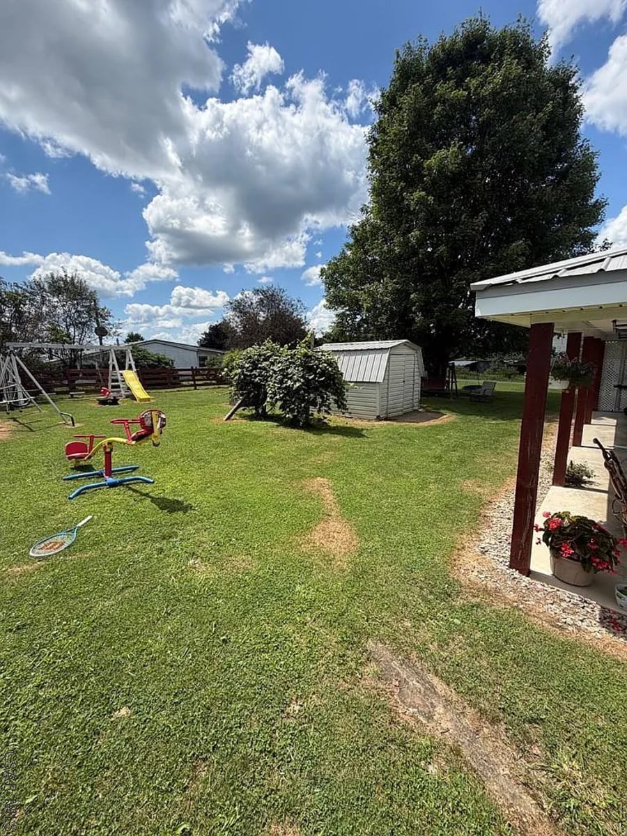 Swing set and play equipment in the yard of a Punxsutawney, PA Amish home